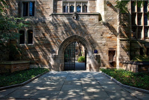 steel gate of brown brick building 159490