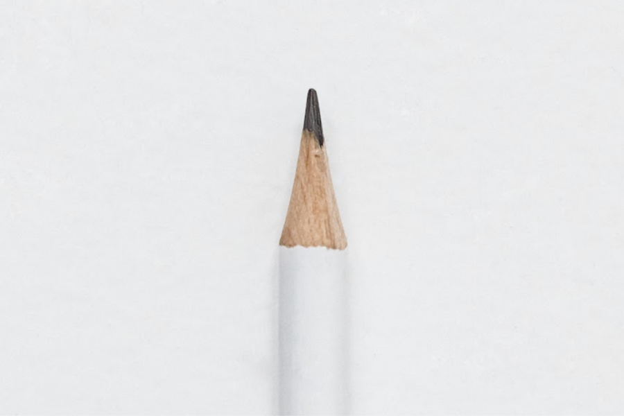 White wooden pencil on white background.