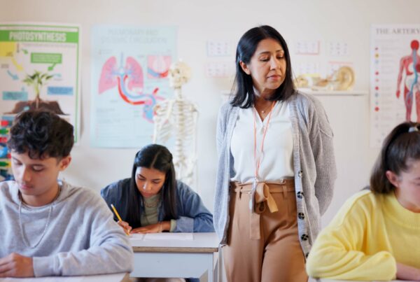 Writing,,Teacher,And,Exam,With,Students,In,Classroom,For,Education,